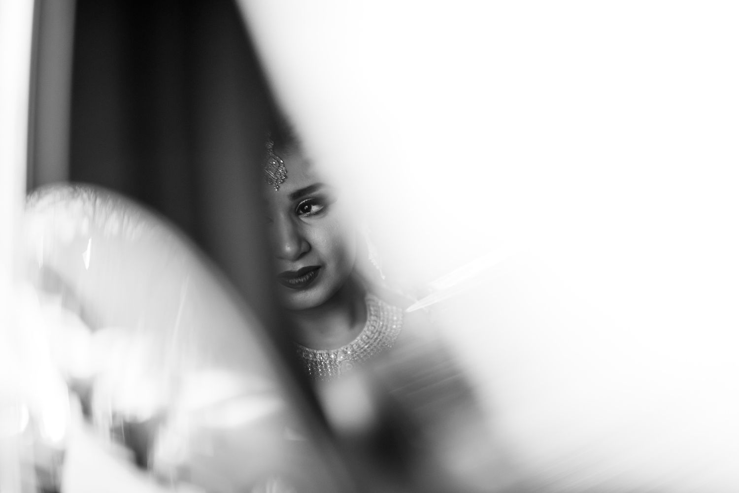 Black and white artistic portrait capturing emotional wedding moment.