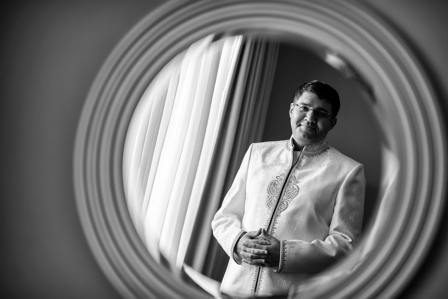 Black and white portraits with circular vignette effect creating dramatic mood.