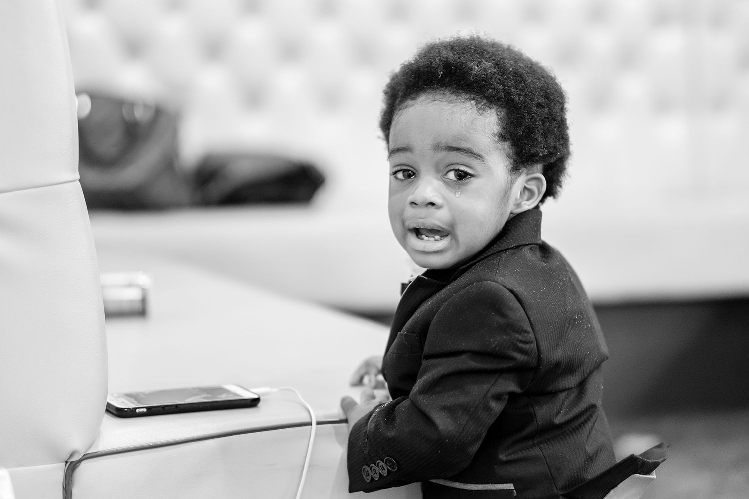 Young children in formal attire at a wedding celebration.