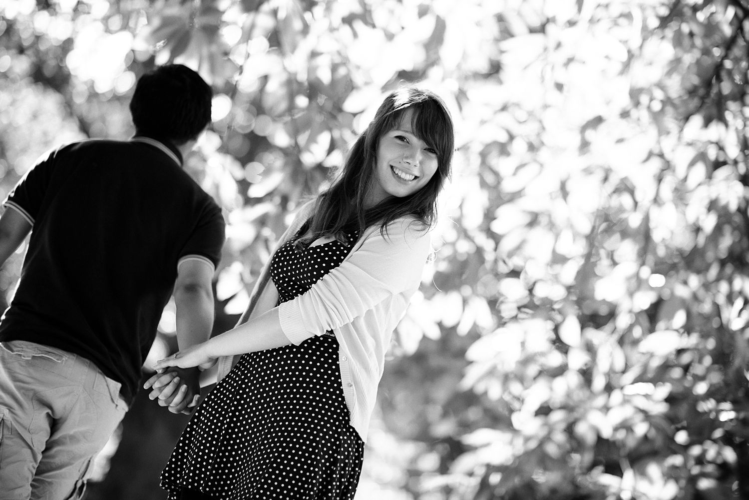 Romantic couple portrait in black and white with soft natural lighting.