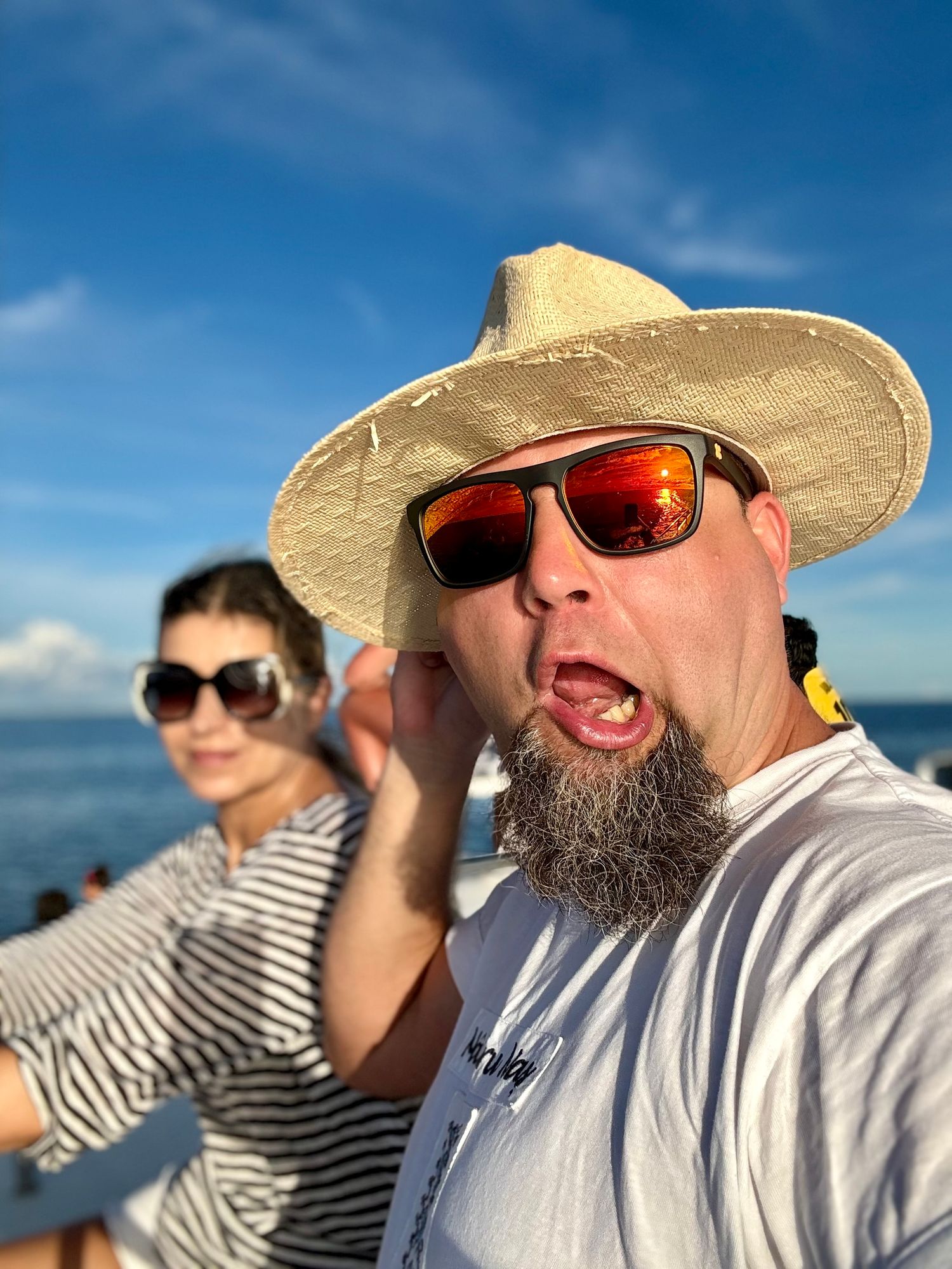 Beach selfies showing people wearing sunglasses and hats against blue sky background.