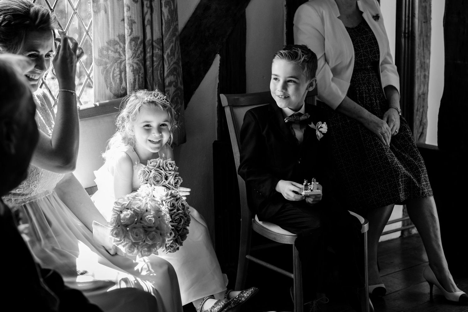 Artistic black and white wedding portraits capturing intimate moments during a celebration.