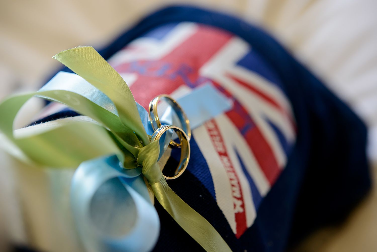 British Union Jack flag with soft focus and decorative ribbons in pastel colors.