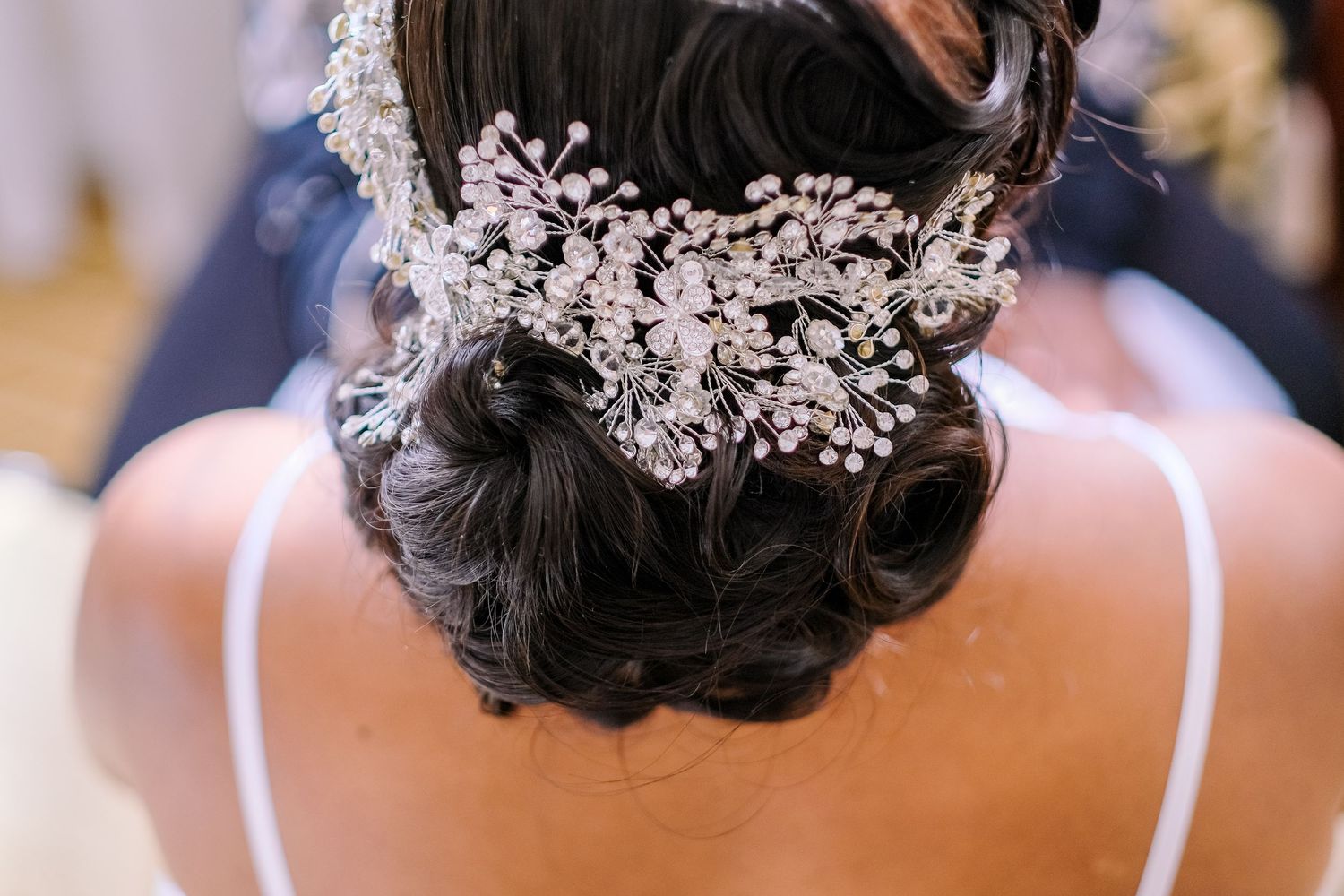Ornate bridal hair accessories and headpieces adorned with crystals and pearls in a row.