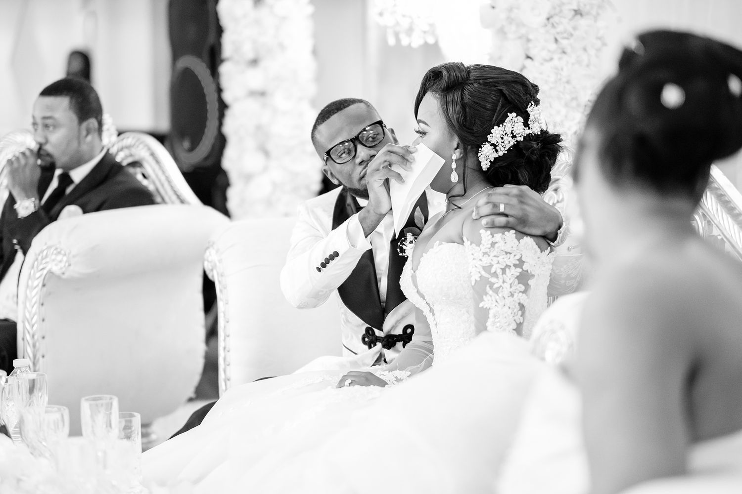 Wedding reception candid moments captured in elegant black and white photography.