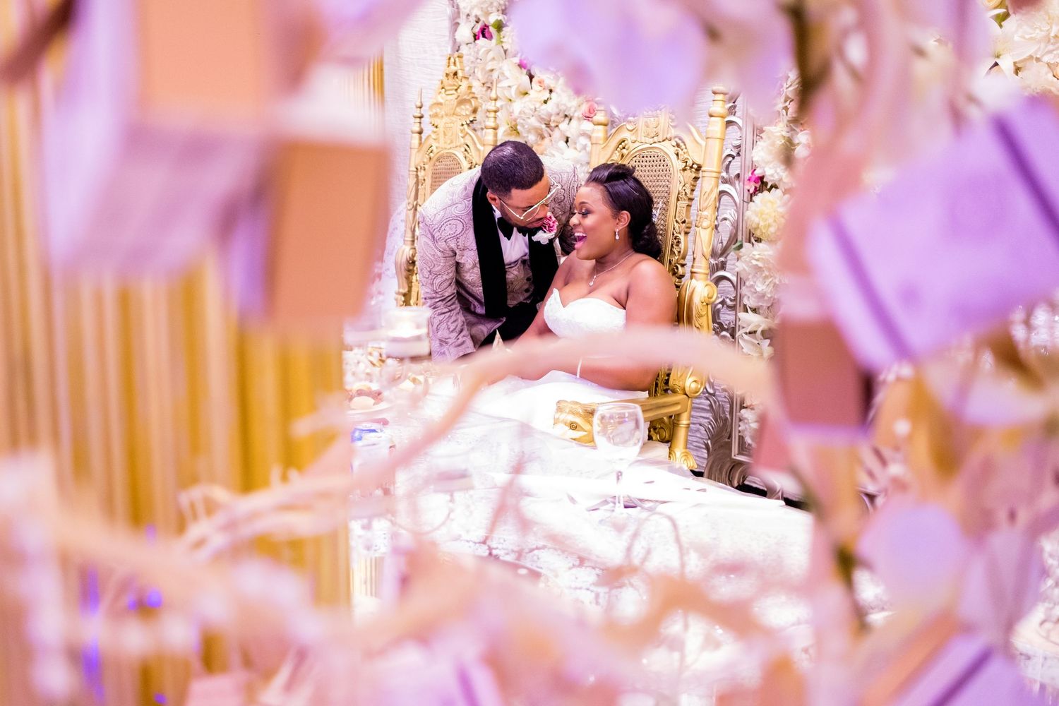 Elegant wedding reception decor with twinkling lights and crystal details creates a romantic atmosphere.