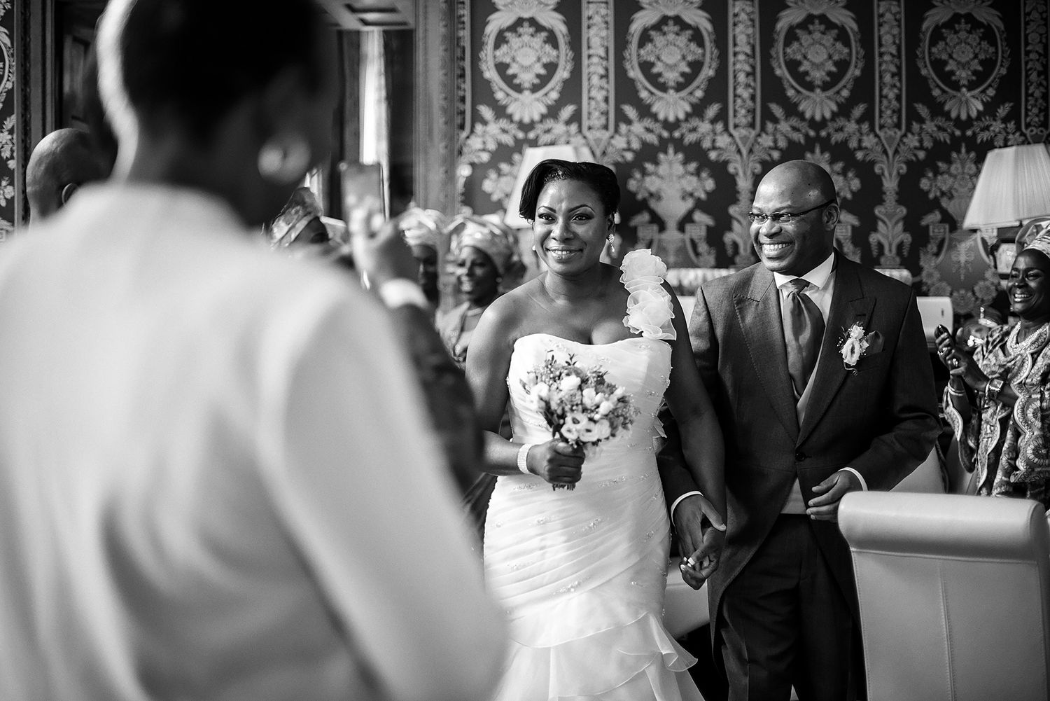 Black and white candid shots of wedding reception celebrations.