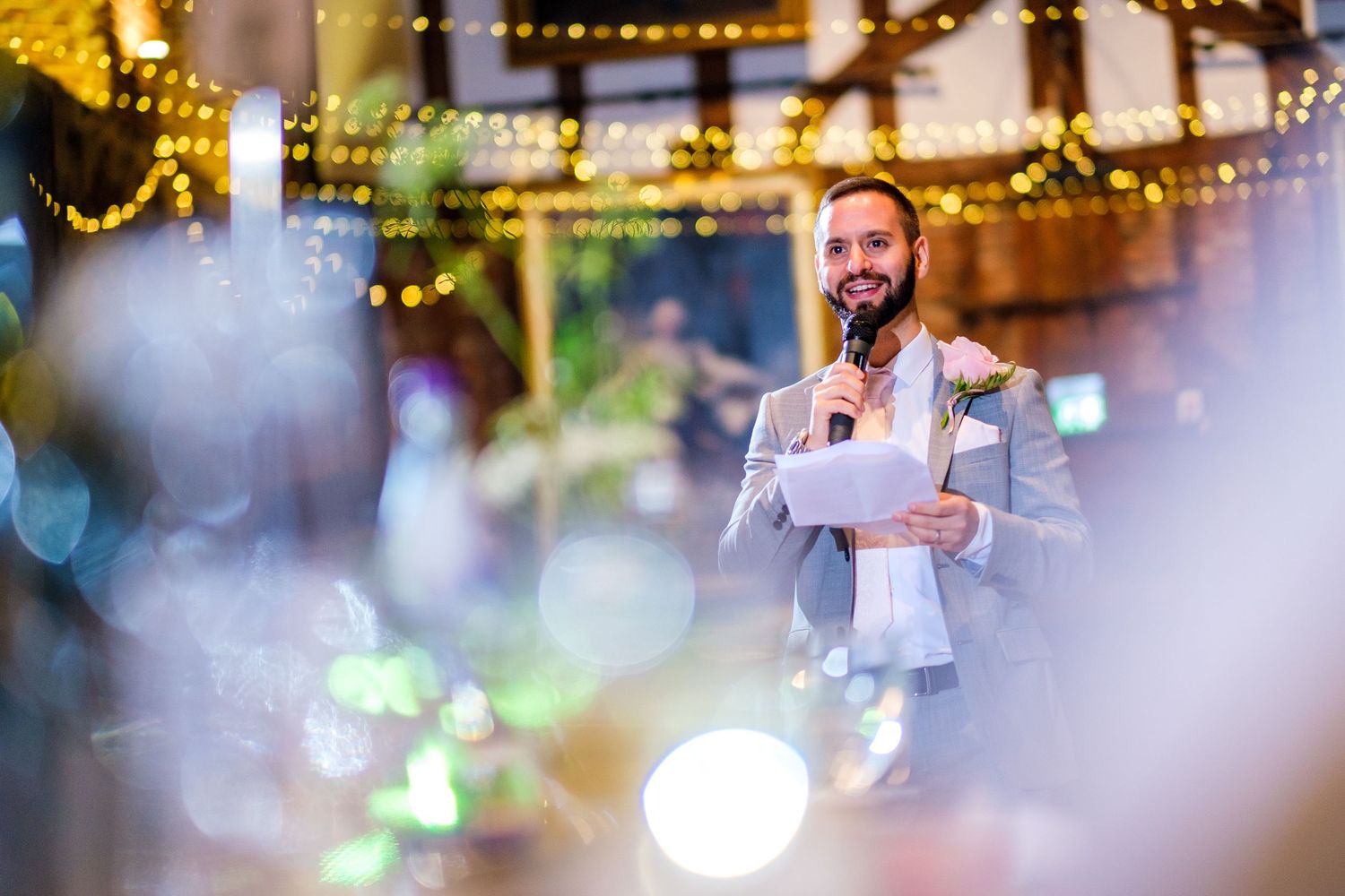 Reception venue decorated with twinkling lights creating romantic ambiance.