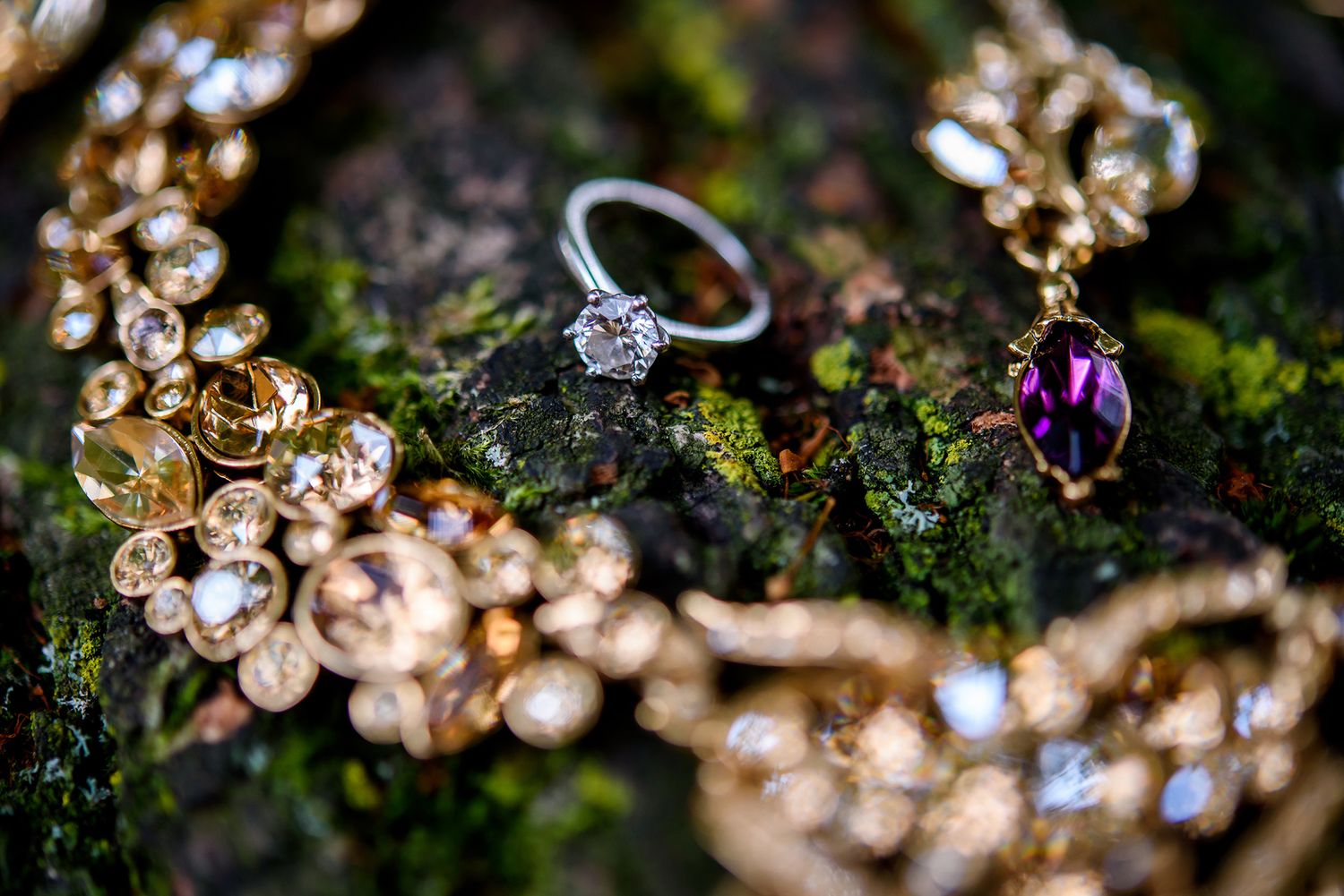 Close-up of sparkling diamond engagement rings with bokeh light effects.