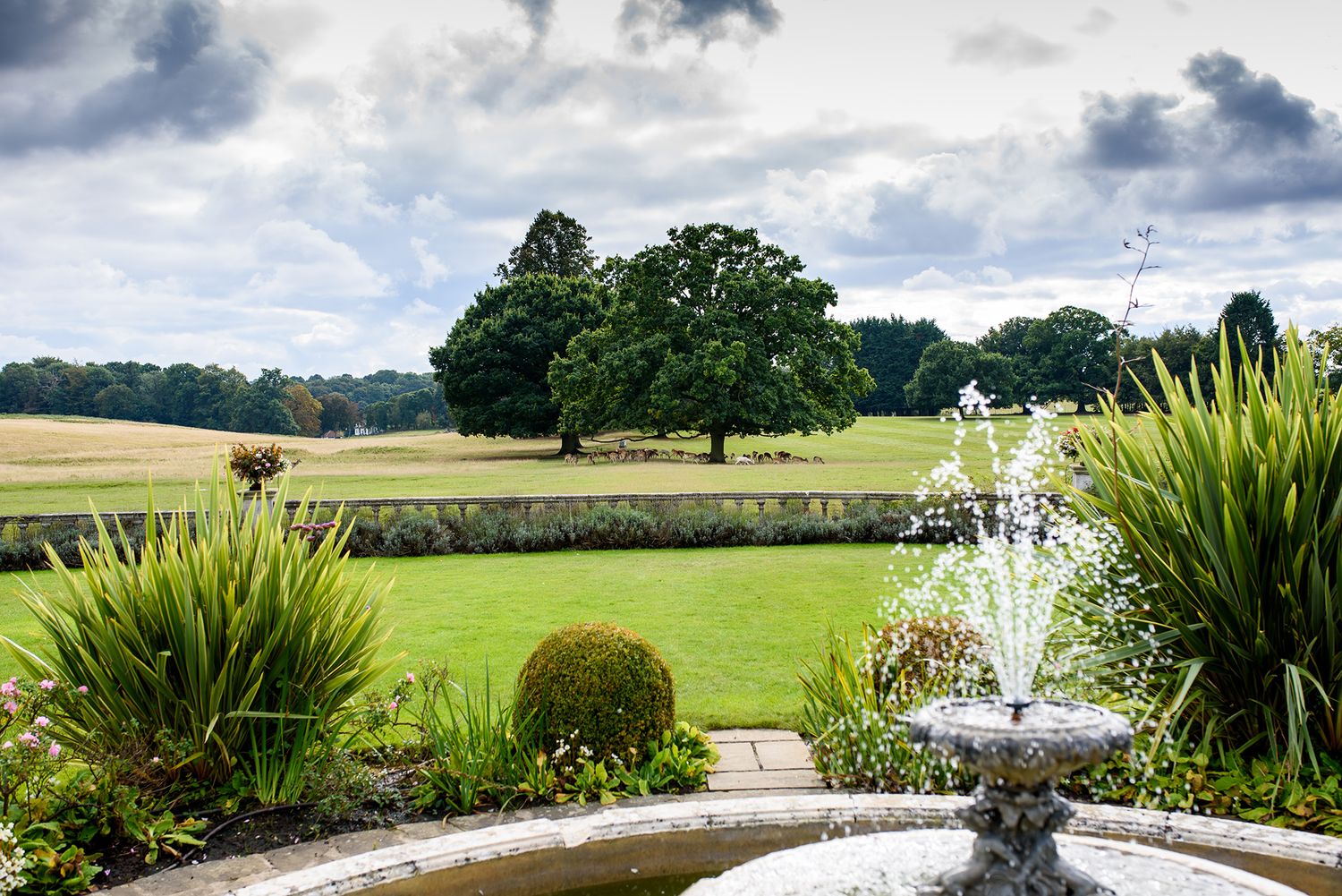 Scenic golf course landscape with fountain and manicured gardens.