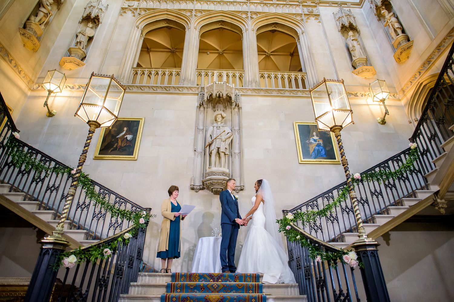 Grand staircase ceremony venue with classical architecture and decorative railings.