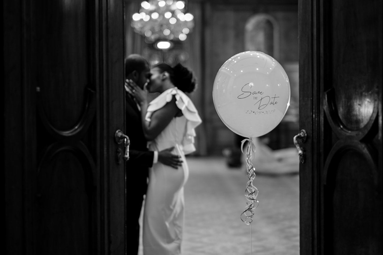 Romantic dancing silhouettes against a backdrop of soft lights in an elegant ballroom.