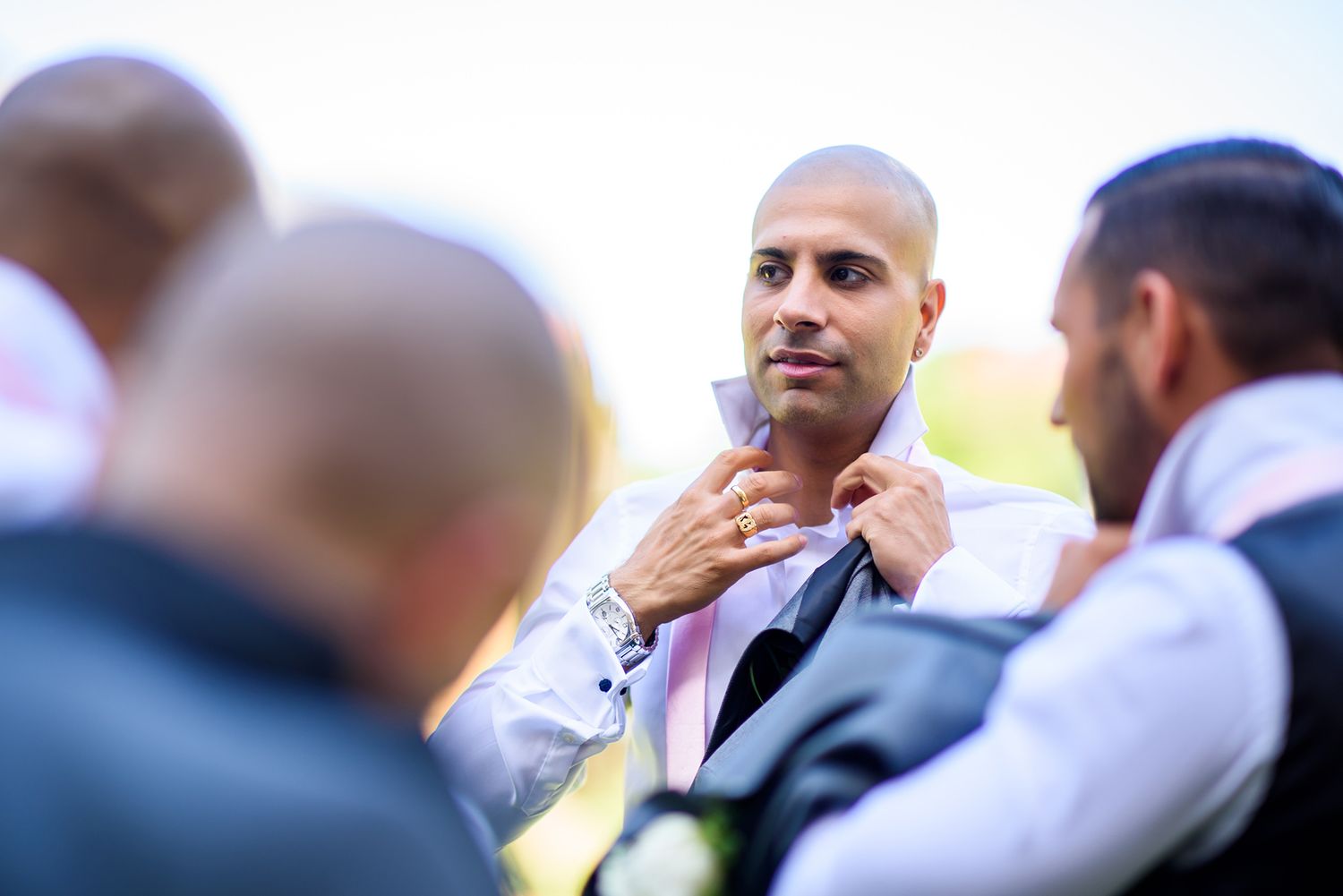 Candid moments captured of wedding party members in formal attire.