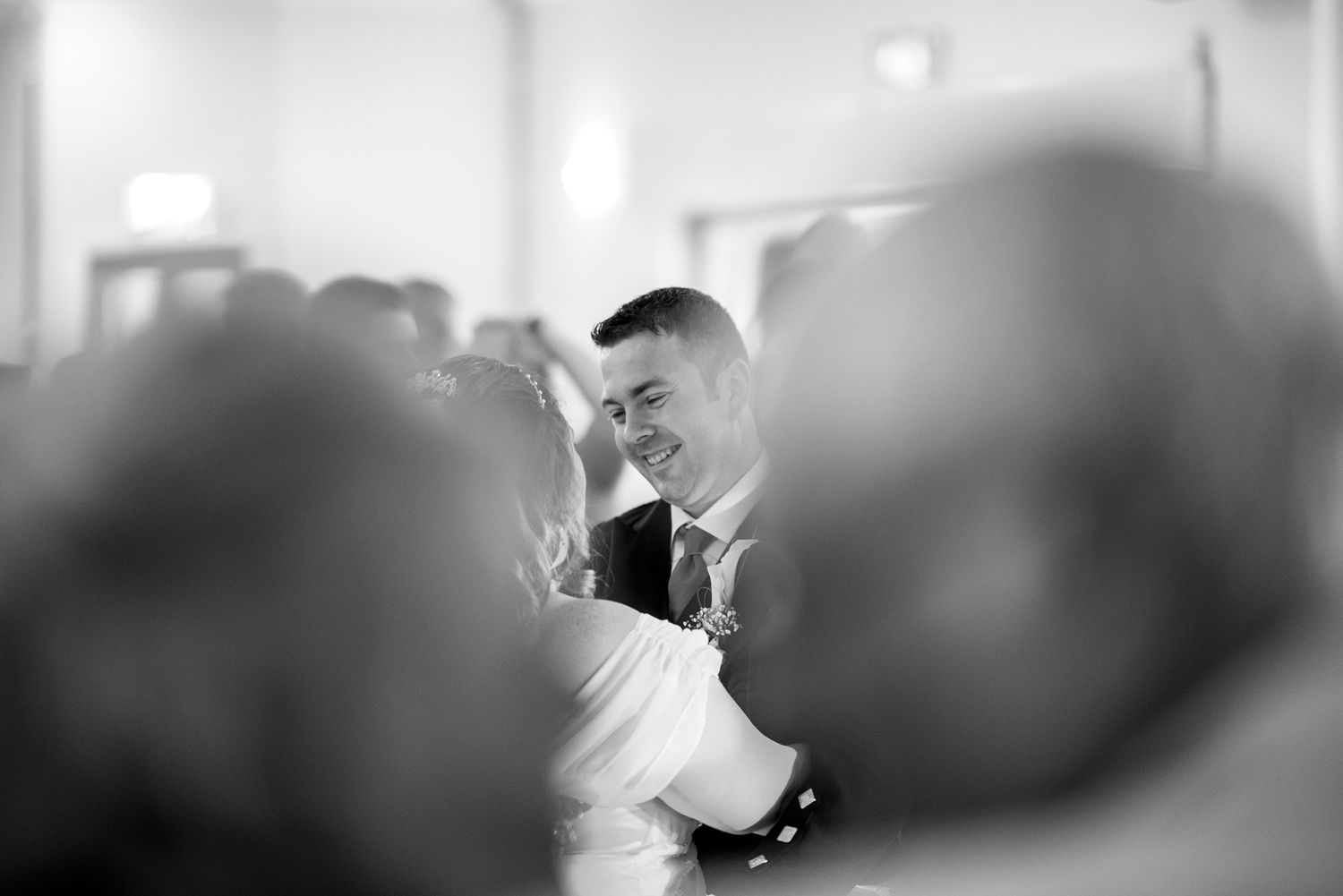 Wedding ceremony candid moments captured in black and white photography.