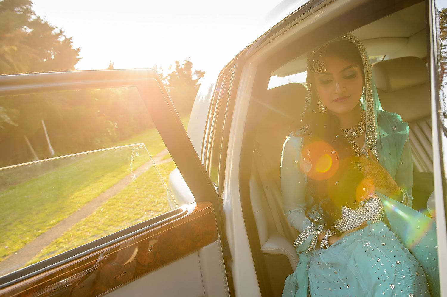 Sunlit view through car window with glowing golden light.