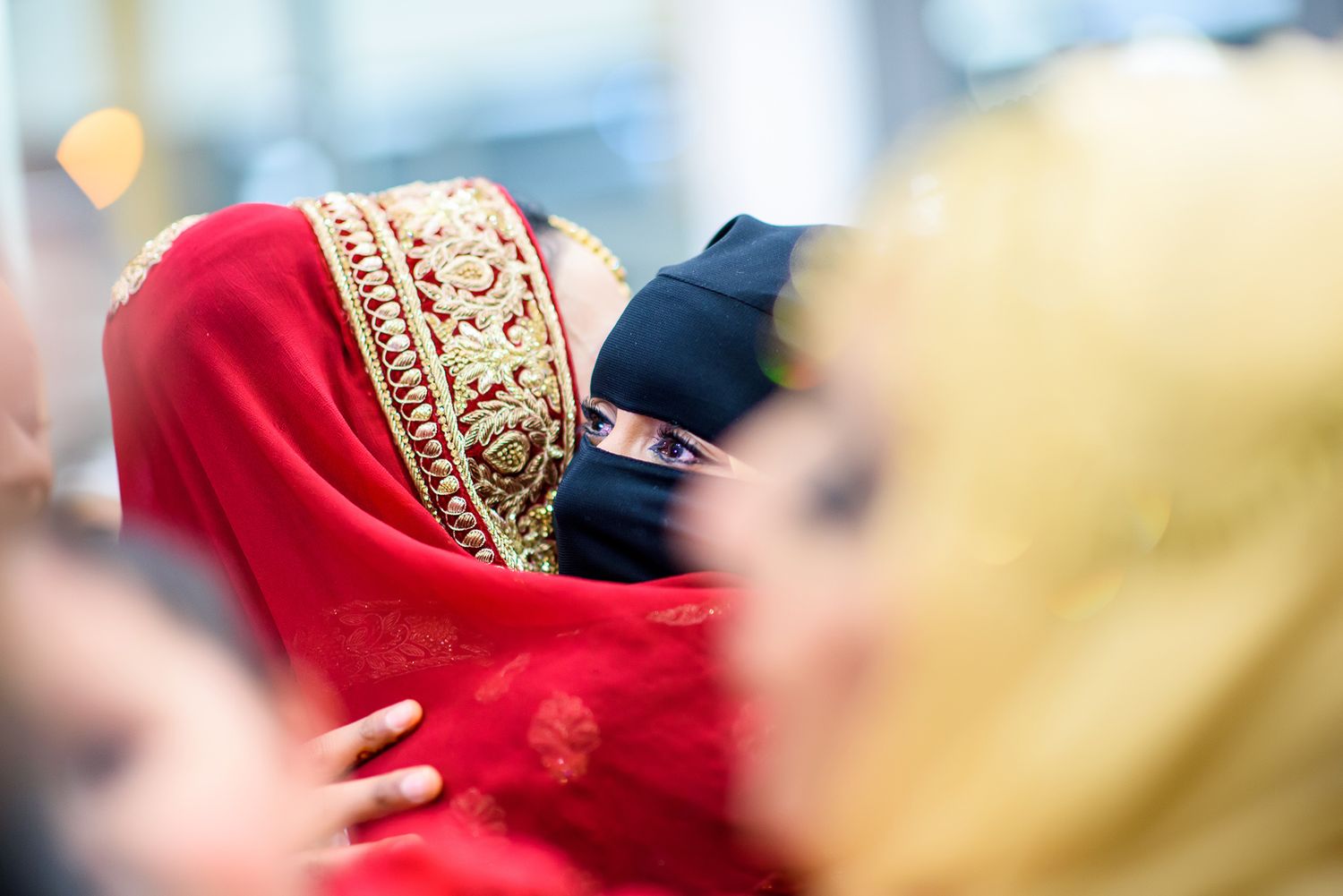 Elegant celebration capturing moments of joy in red and white cultural attire.