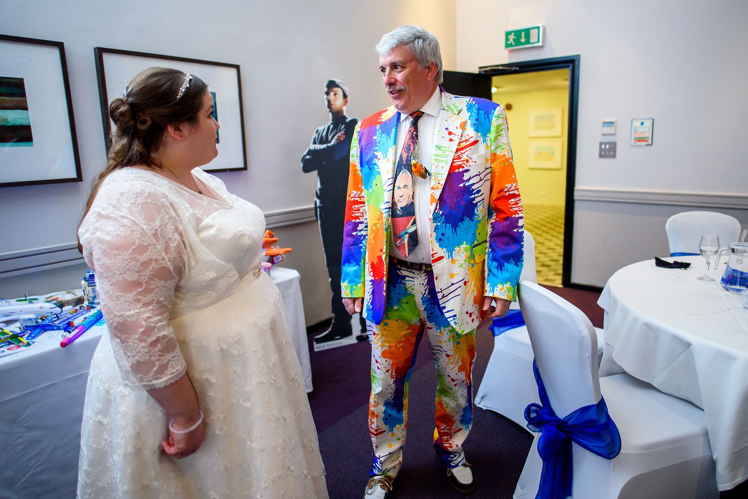 Wedding celebration in a modern venue with colorful decorative elements.