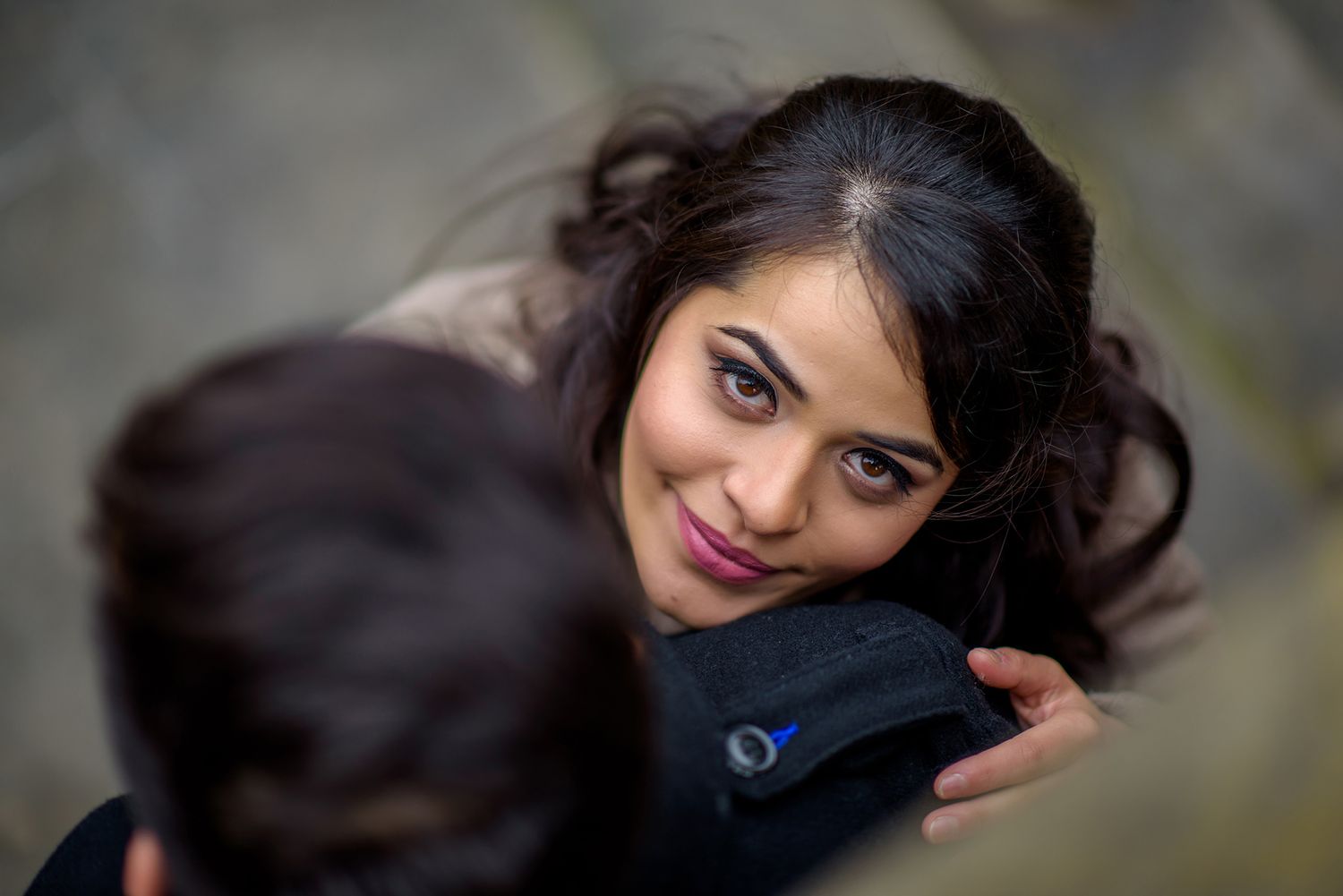 Stylized portrait series capturing romantic close-up shots against a blurred background.