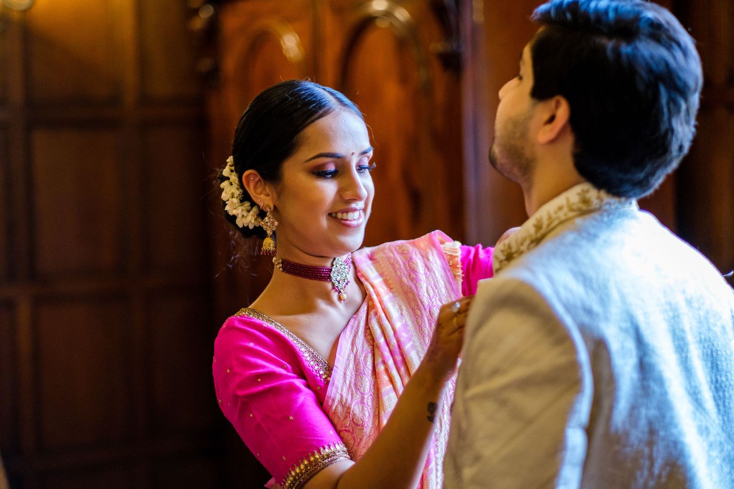 A couple shares tender moments in traditional Indian wedding attire during their ceremony celebrations.
