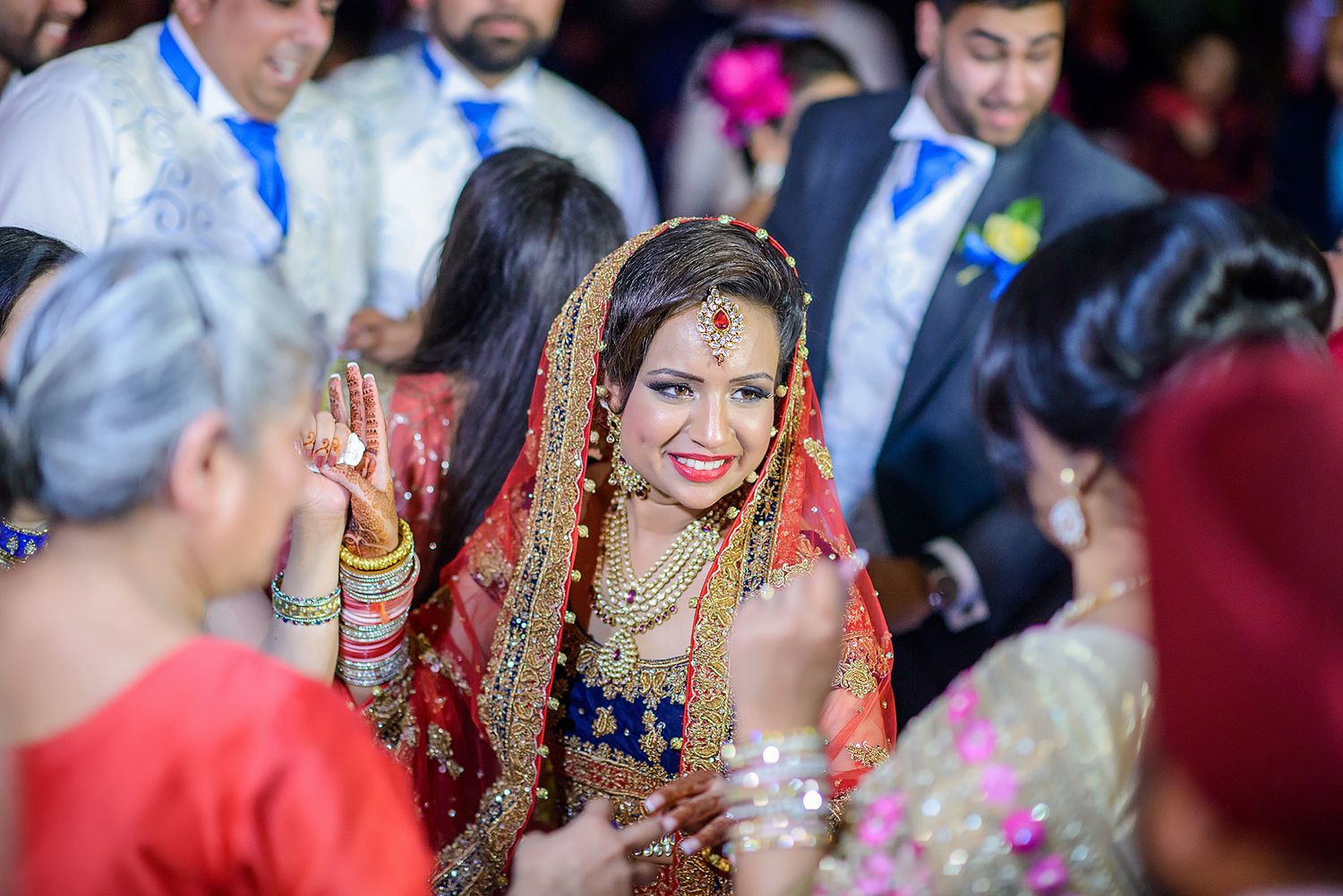 A festive Indian wedding celebration filled with vibrant traditional outfits and decorations.