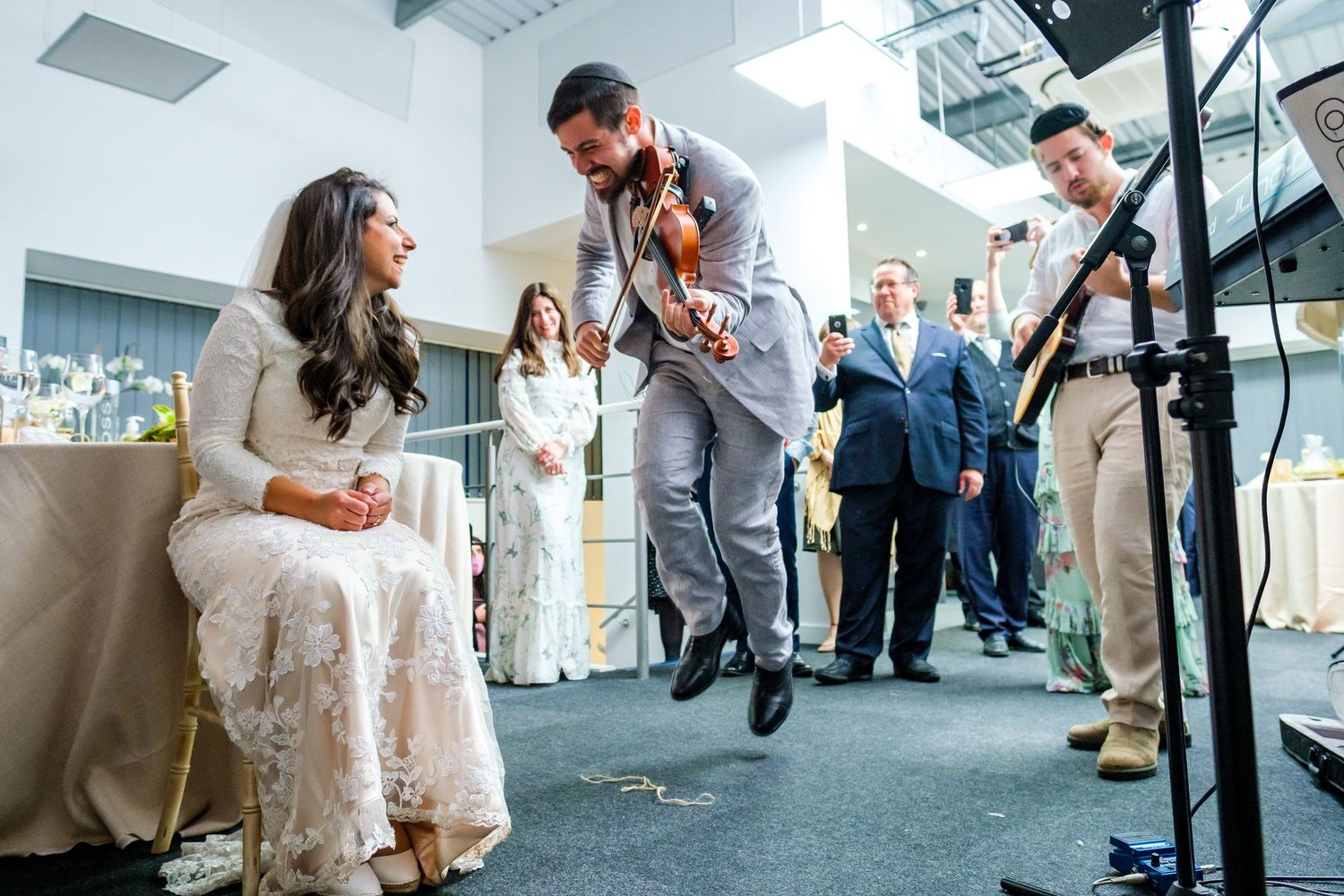Wedding celebration candid moments captured in an industrial modern space.