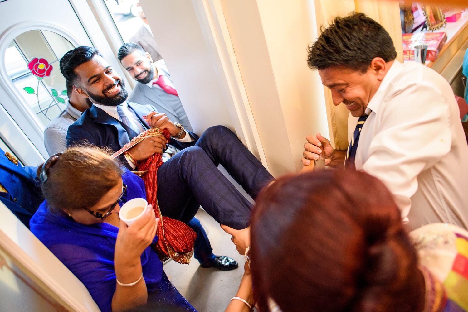 Wedding celebration captured in motion with guests interacting during festivities.