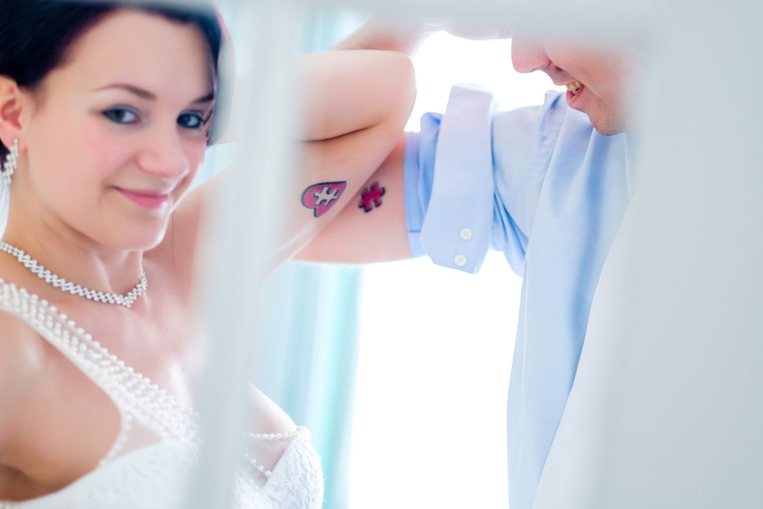 Elegant pearl necklace and delicate bridal details are showcased in a series of close-up wedding photographs.