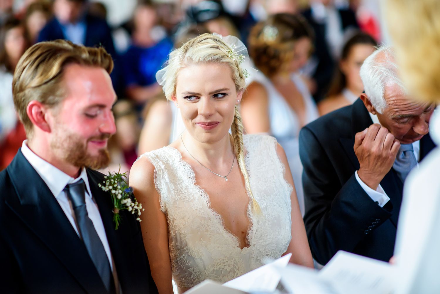 Emotional moments captured during a wedding ceremony in a traditional church setting.