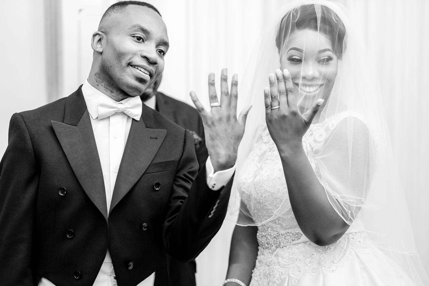 Tender moment shared during an elegant black and white wedding ceremony.
