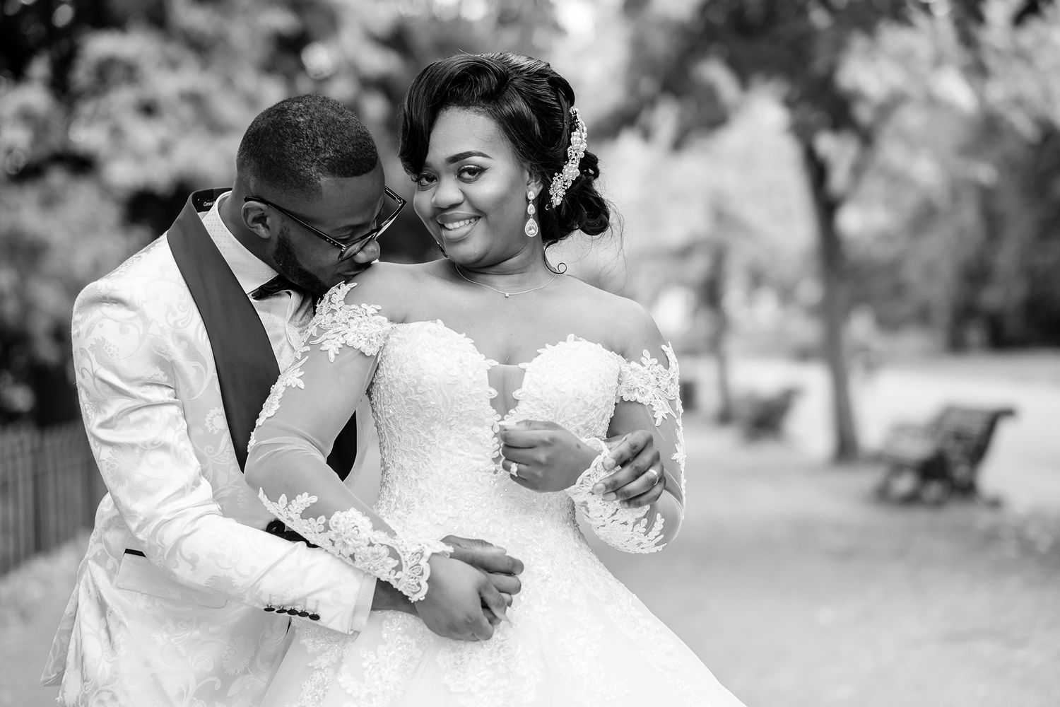 Black and white wedding portraits capturing intimate moments between the newlyweds.