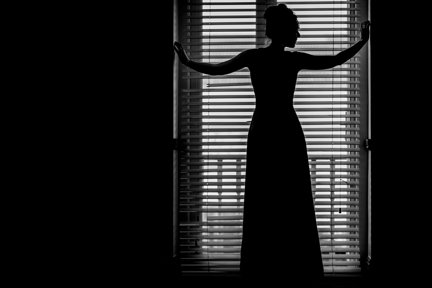 Dramatic silhouette shots through window blinds creating artistic wedding photographs.