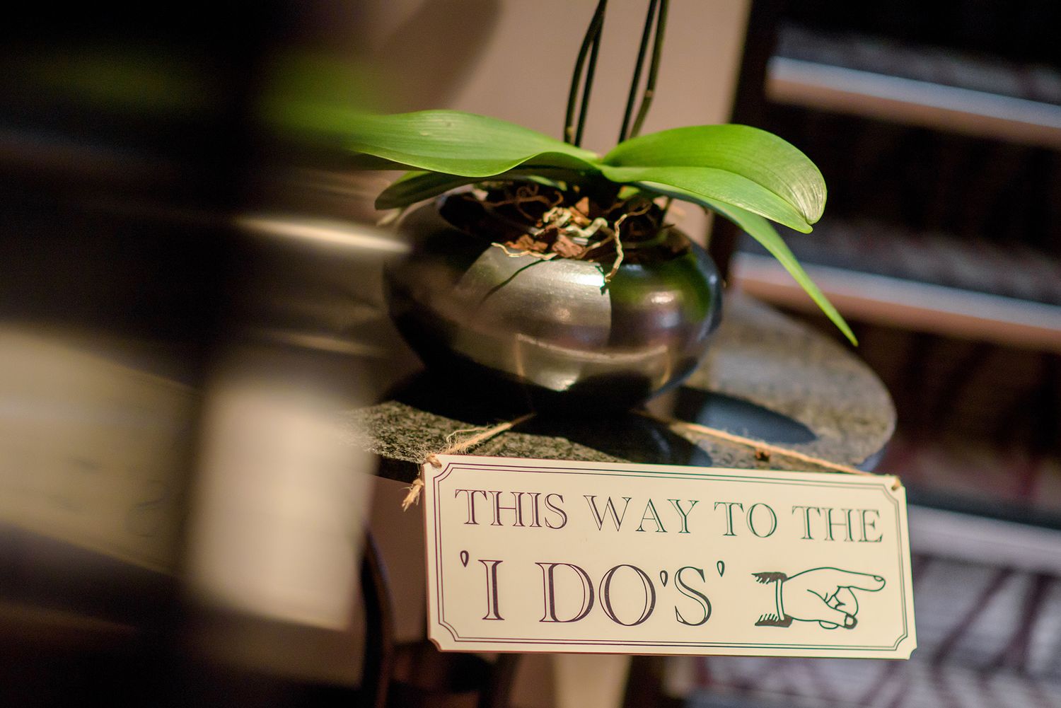 Decorative wedding signage and details in rustic setting.