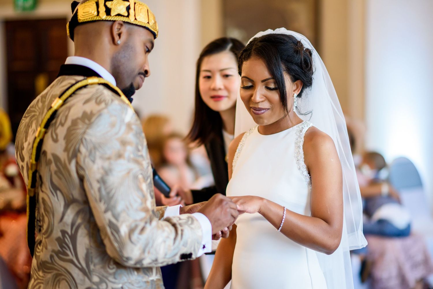 Wedding ceremony with military service member and bride exchanging vows in formal attire.