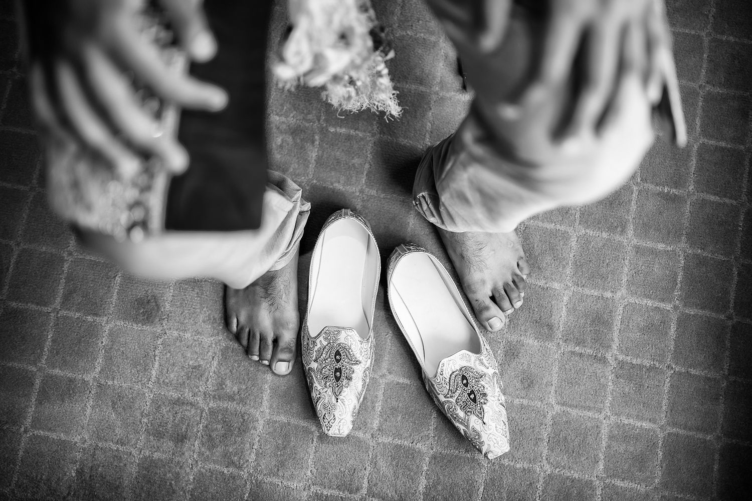 Black and white detail shots of traditional wedding attire and accessories.