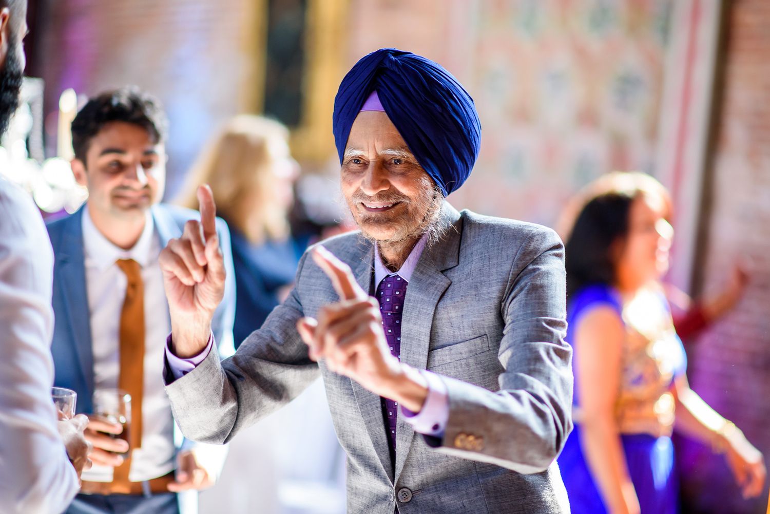Guests dance and enjoy themselves during a festive celebration.