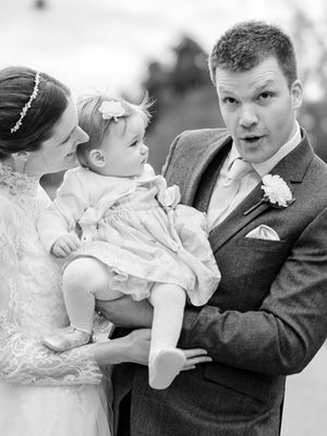 Series of tender moments between a parent and baby in formal attire.
