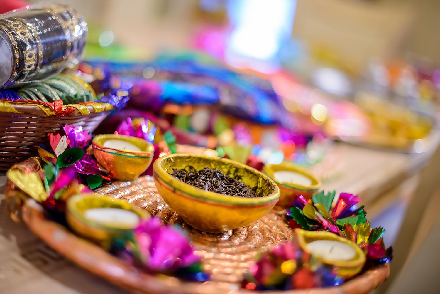 Colorful decorative food platter with exotic fruits and floral garnishes.