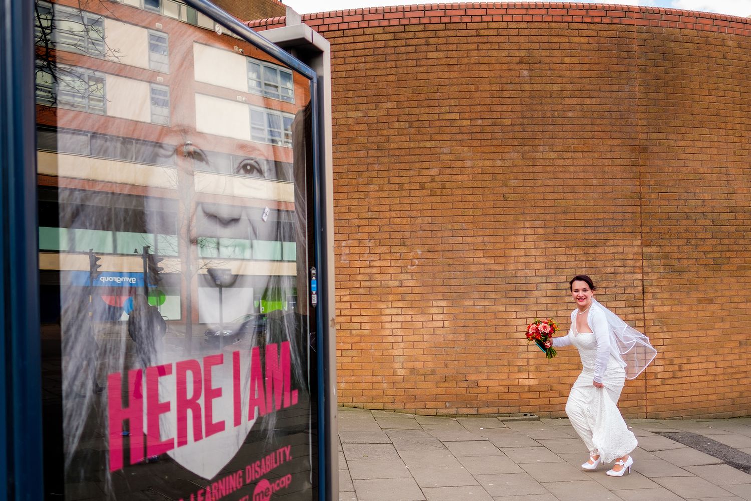 Urban street art and brick walls create a dramatic backdrop for wedding photography.
