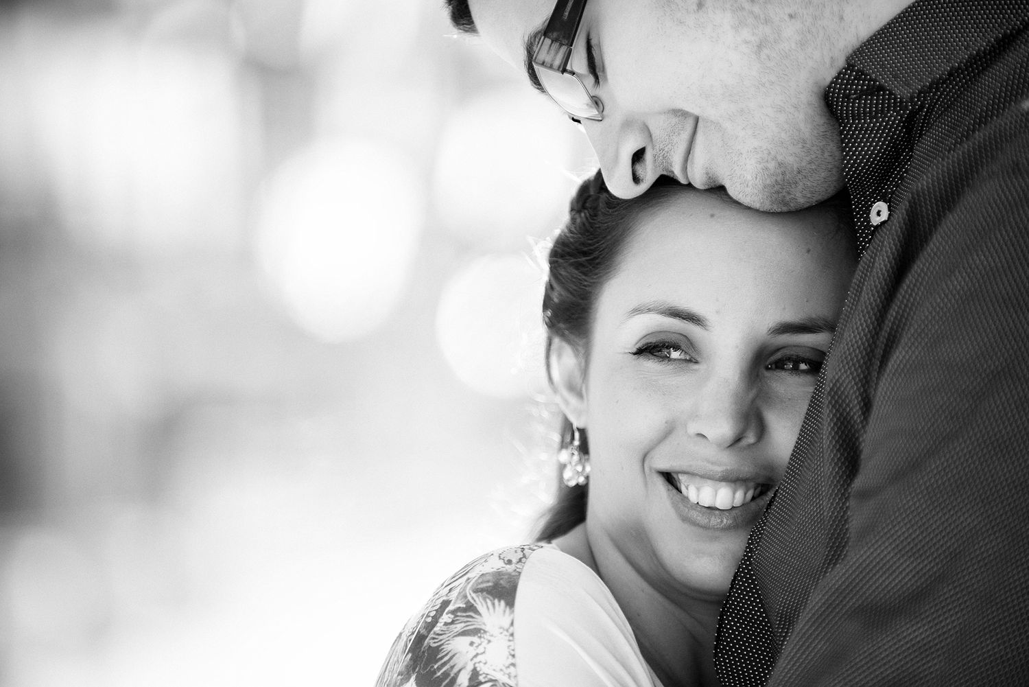 Intimate black and white portrait with soft natural light.
