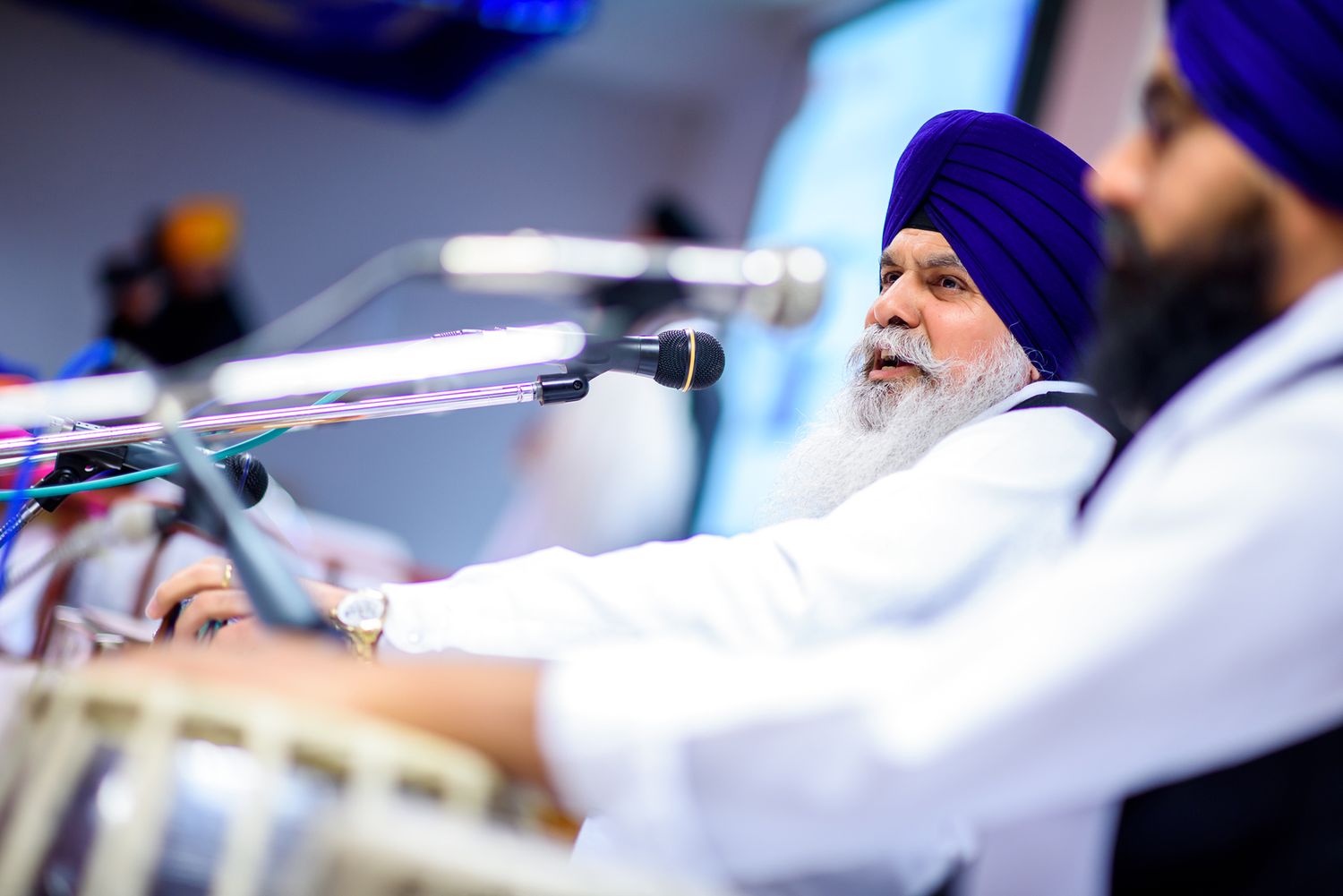 Musicians perform with traditional instruments at a Sikh ceremony.
