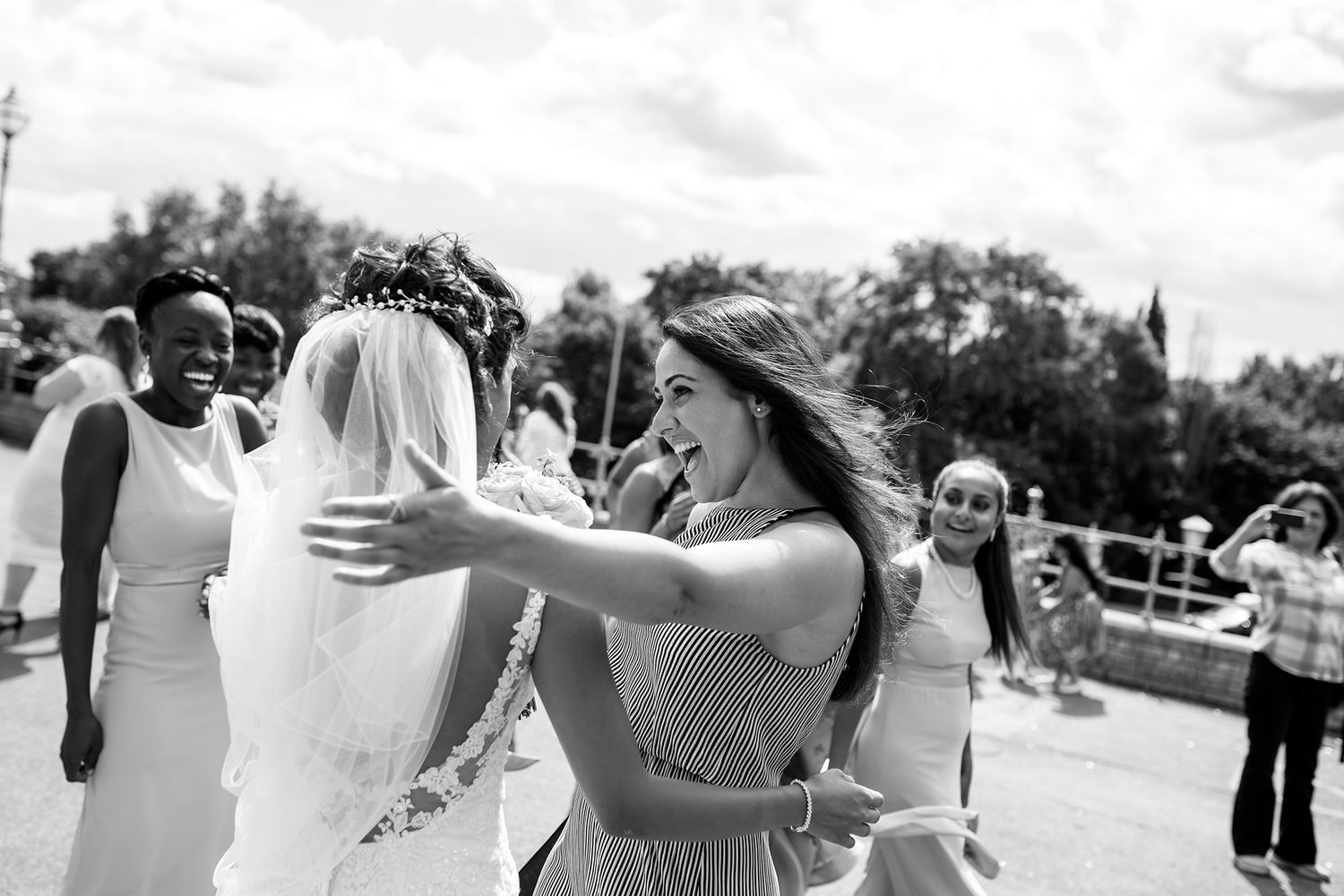 A series of candid wedding photos showing tender moments between the couple outdoors.