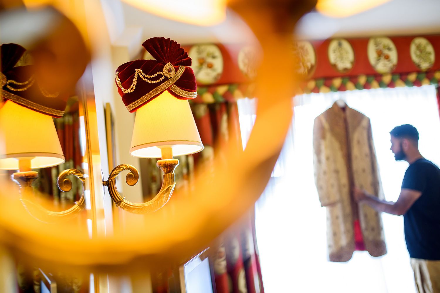 Luxurious interior with warm lighting and decorative elements at an Indian wedding venue.