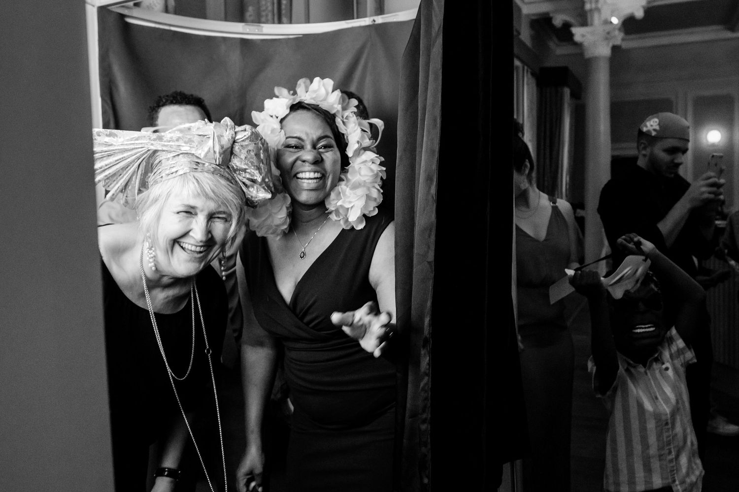 Black and white candid shots capture emotional moments during a wedding celebration.