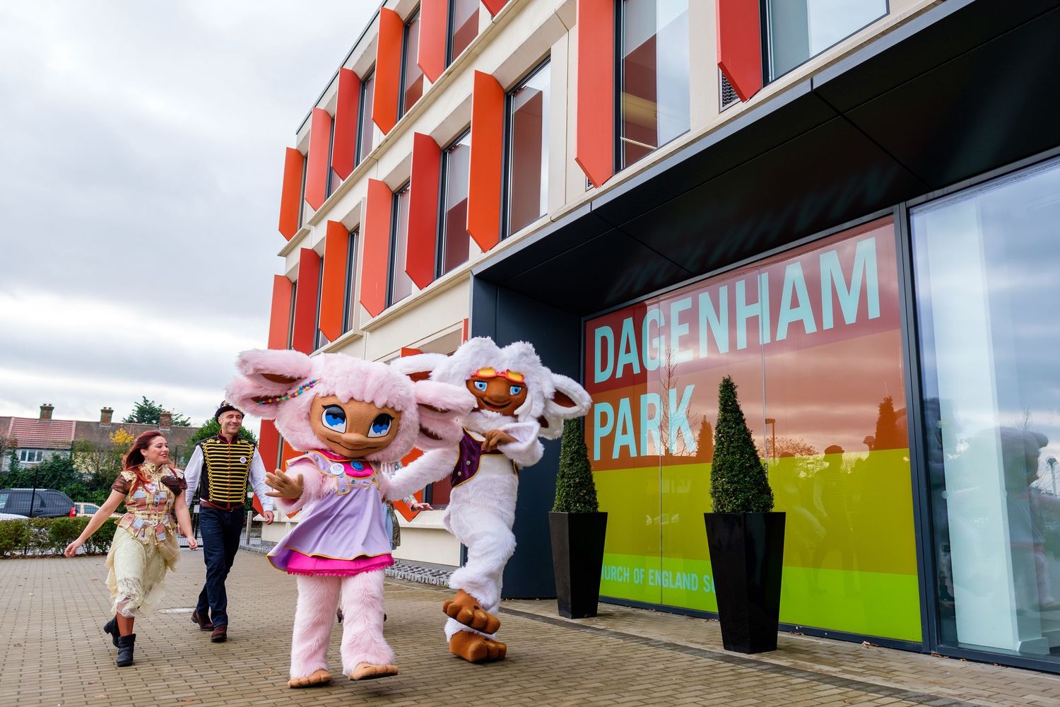 Performance or event taking place outside a large retail building.