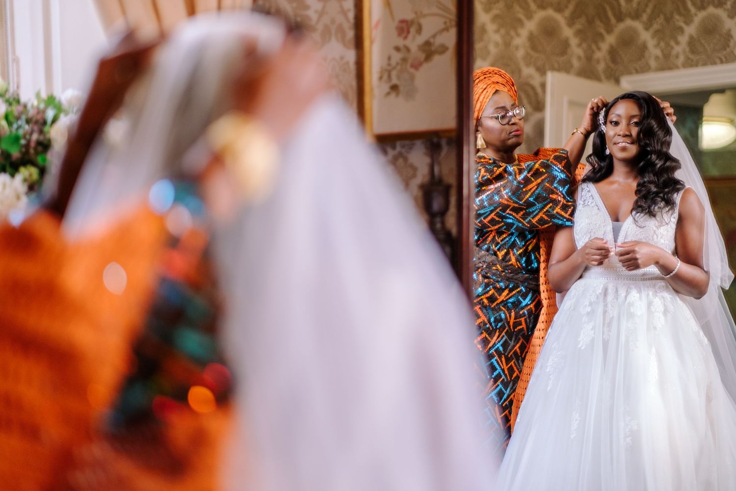A romantic wedding ceremony moment captured with soft lighting and floral decor.