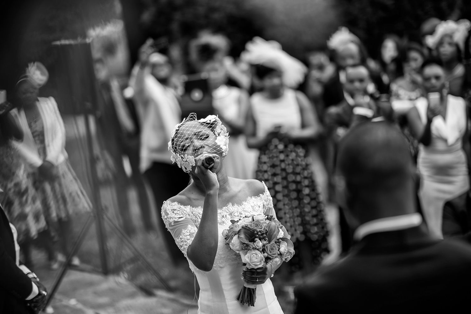Black and white candid shots of wedding reception moments.