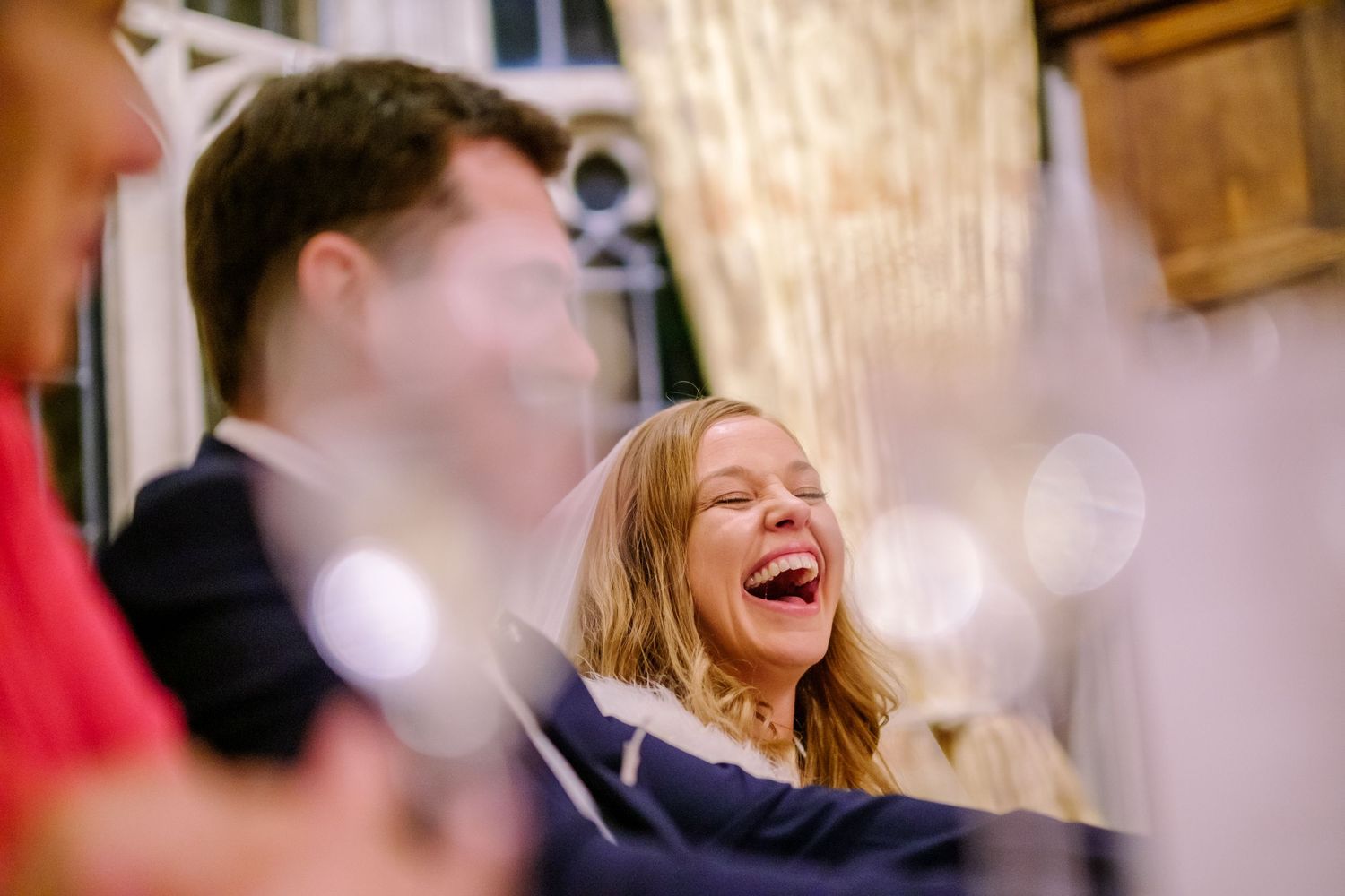 A series of candid photos showing people laughing and having fun at a social gathering.