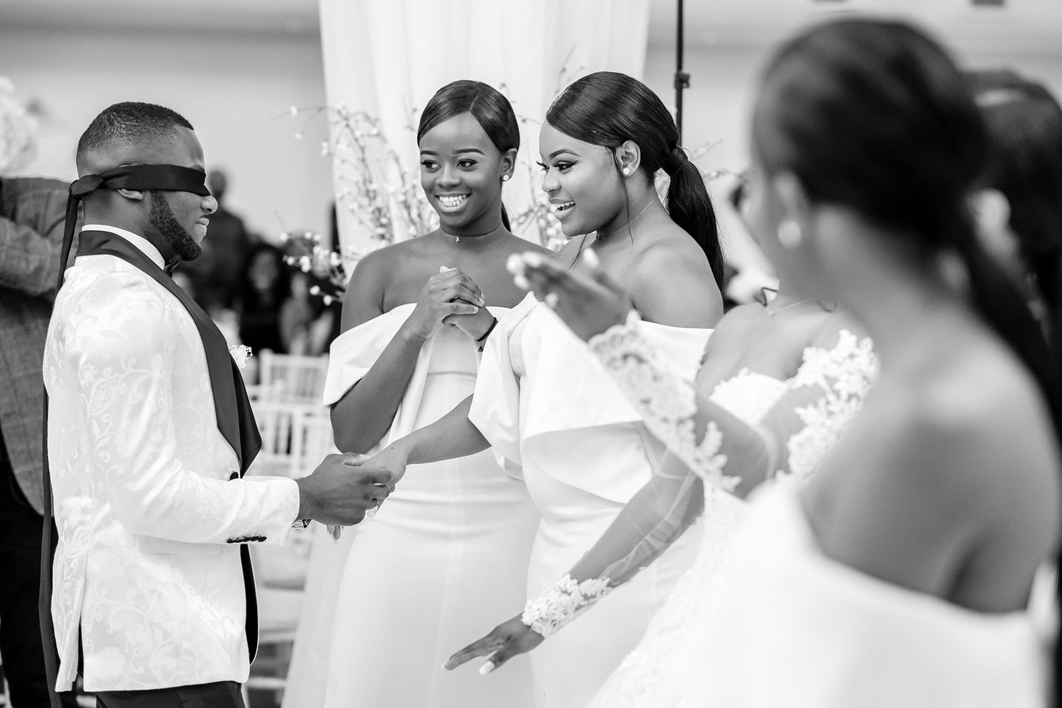 Wedding guests enjoying a group dance together during a reception celebration.