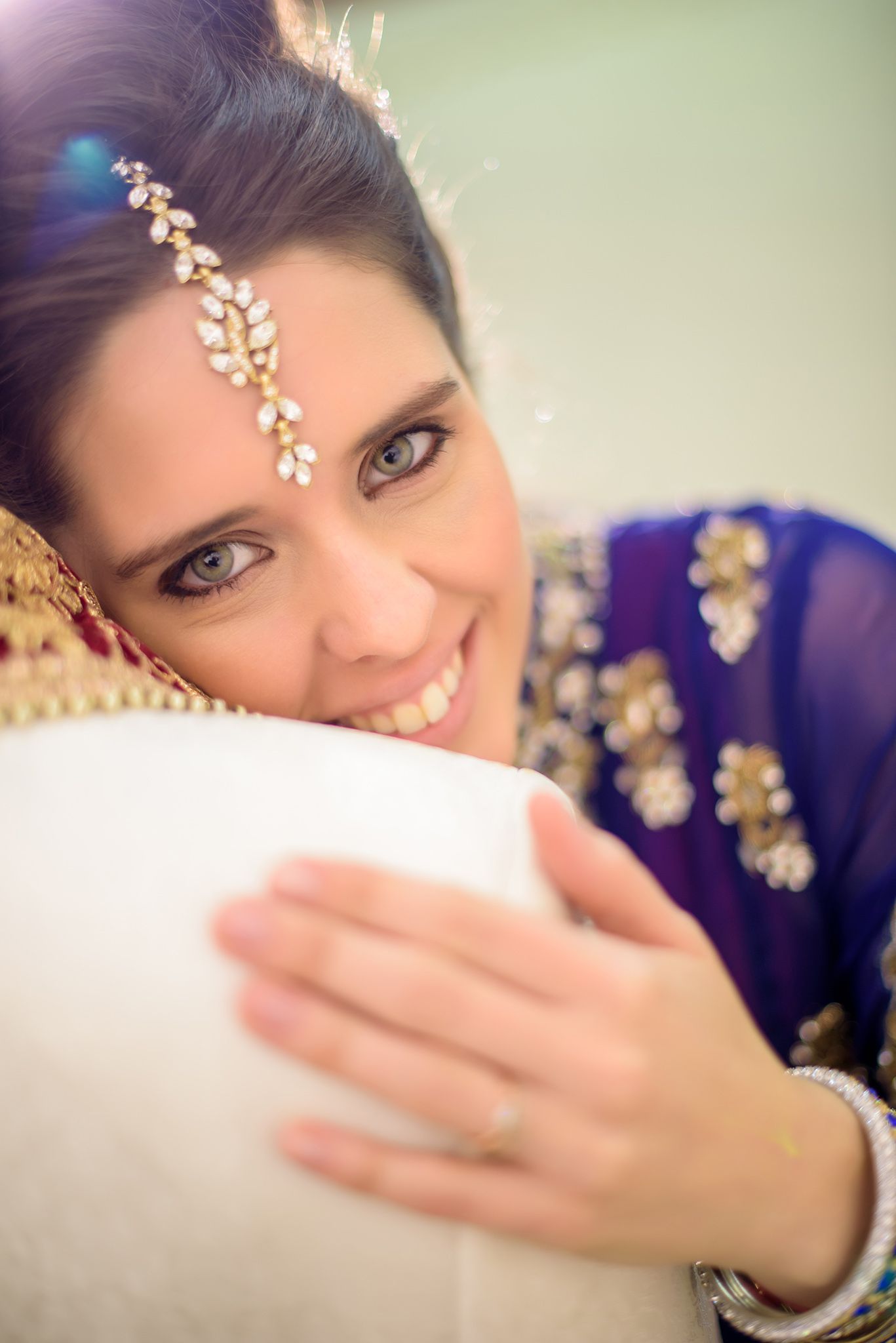 Close-up shots show intricate bridal jewelry and makeup details in warm lighting.