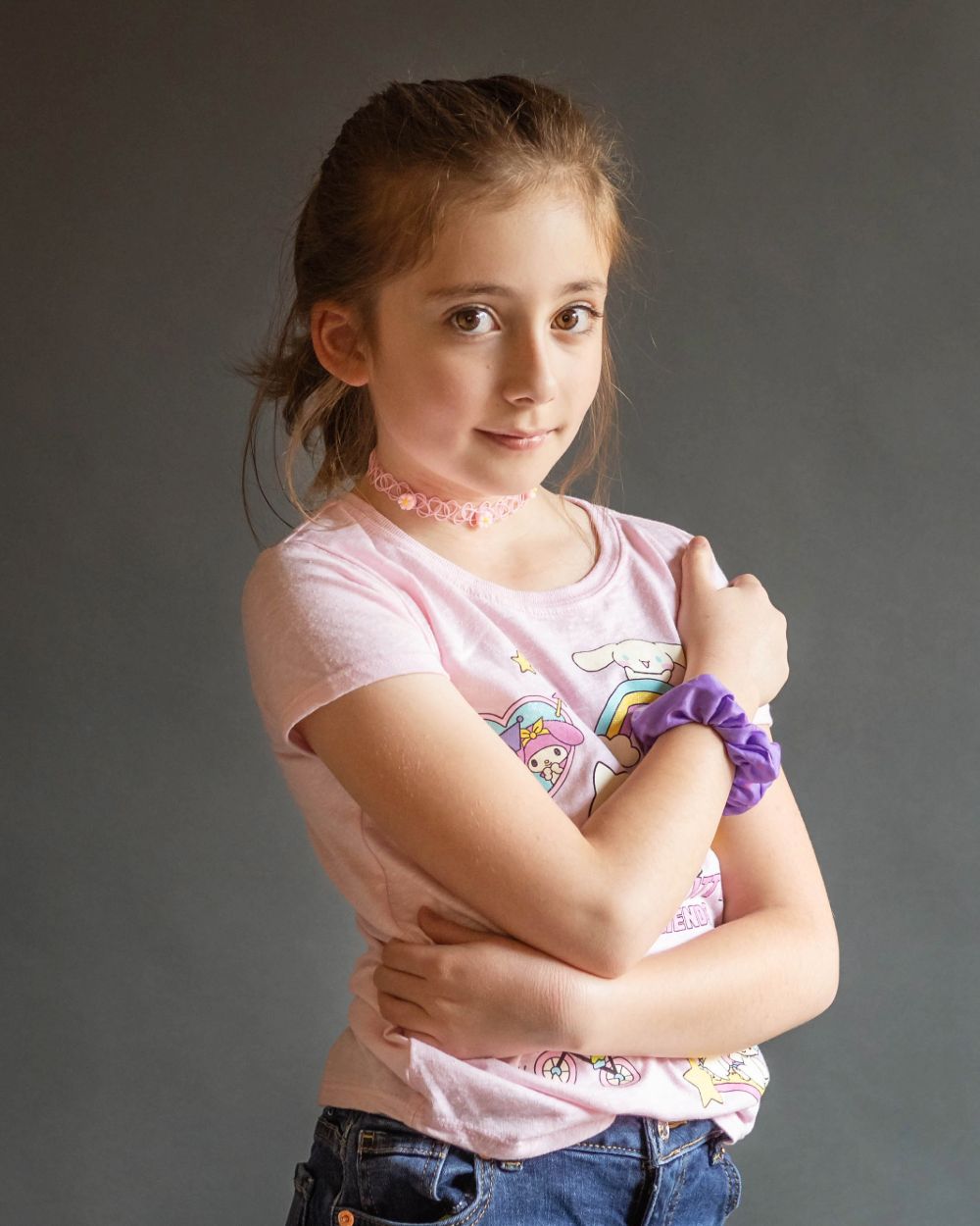 Portrait of girl standing up with arms crossed